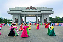 Mass dancing with women in colourful traditional dress, Pyongyang, Democratic Peoples' Republic of Korea (DPRK), North Korea, 2012