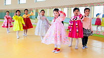 Children in traditional clothes, waving to camera, Mangyongdae Schoolchildren's Palace, dedicated to childrens after school activities, Pyongyang, Democratic Peoples' Republic of Korea (DPRK), North K...