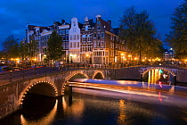 Traditional Gabled houses and bridges on the corner of Keizersgracht and Leidesegracht at dusk, Amsterdam, Holland, Netherlands, 2007