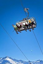 People on modern chairlift overhead, St Anton am Arlberg, Tirol, Austria, 2009