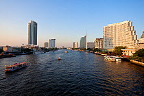 Chao Phraya river and the modern Bangkok skyline, Bangrak district, Bangkok, Thailand, 2010
