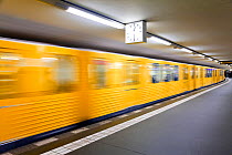 Moving train pulling into the station in new subway train station, Berlin, Germany 2007