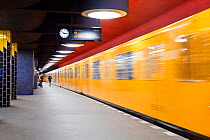 Moving train pulling into the station in new subway train station, Berlin, Germany 2009
