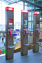 Row of modern public telephones in modern train station, Berlin, Germany 2009