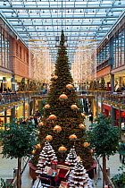 Christmas trees illuminated and decorated for festive season, Arkaden shopping centre in Potsdamer Platz, Berlin, Germany 2009