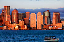 City skyline viewed across harbour at dawn, Boston, Massachusetts, USA 2009