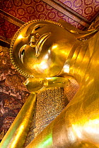 Wat Pho, Reclining Buddha, 46 metres long made of brick plaster and Gold leaf the soles of the feet are inlaid with 108 lakshana, or auspicious images that identify the true Buddha crafted in mother-o...