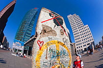 Painted section of the Berlin Wall left standing in Potsdamer Platz, Berlin. As was the case in much of Berlin, many of the buildings around Potsdamer Platz were turned to rubble by air raids and heav...