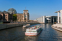 The Reichstag, German Government Parliament building, river Spree and a tourist boat, Berlin, Germany, 2007