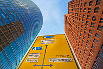 Low angle view of traffic sign and skyscrapers, Potsdamer Platz, Berlin, Germany, 2007. As was the case in much of Berlin, many of the buildings around Potsdamer Platz were turned to rubble by air rai...