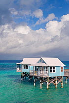 Vacation cottages on stilts over ocean, Sandys Parish, Bermuda 2007