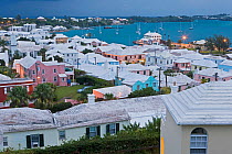 Elevated view at dusk over the harbour and white stone roofed pastel coloured buildings of historical town of St George, an UNESCO World Heritage Site, St George's Parish, Bermuda 2007