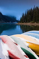 Canoes on jetty covered in early winter snow, Valley of the Ten Peaks, Moraine Lake, Banff National Park, Rocky Mountains, Alberta, Canada, 2007