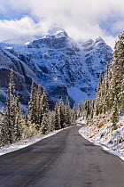 Wenkchemna Peaks or Ten Peaks rising over road in the snow, near Lake Louise, Banff National Park, Alberta, Canada, 2007