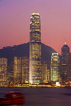 Giant skyscraper of the International Finance Centre towering over the Hong Kong skyline at 88 stories and 415m tall, illuminated at night, Hong Kong, China 2007