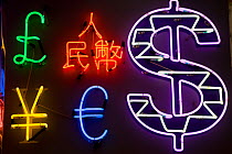 Neon signs in shape of foreign currencies, Tsim Sha Tsui, Kowloon, Hong Kong, China 2007