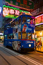 Brightly coloured trams running between Central and Wan Chai, Hong Kong, China 2007