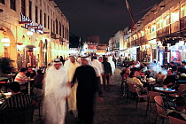 The restored Souq Waqif with mud rendered shops and exposed timber beams at night, Doha, Qatar, Arabian Peninsula, 2011. No release available.
