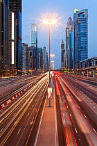 Sheikh Zayed Rd at dusk with traffic and new high rise buildings along Dubai's main road, United Arab Emirates 2011