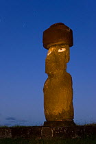 Moai statue Ahu Ko Te riku, the only topknotted and eyeballed Moai on the Island at night, Easter Island, Rapa Nui, Chile 2008