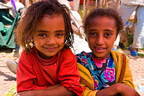 Portrait of two children at Saturday market, people walk for days to trade in this famous weekly market, Lalibela, Ethiopia 2005