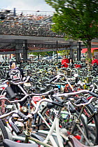 Bicycle park in cental Amsterdam outside the main train station, Holland, Netherlands 2010