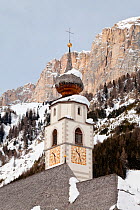 The church and village of Colfosco in Badia (1645m) and Sella Massif range of Mountains under winter snow, Dolomites, South Tirol, Trentino Alto-Adige, Italy 2009