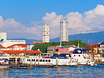 Boats in harbour and Georgetown city skyline with Victoria Memorial Clock Tower, Penang, Pulau Pinang, Malaysia 2008