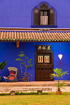 Detail of Trishaws lined up against a blue painted wall in Chinatown district, Georgetown, Penang (Pulau Pipang) Malaysia 2008
