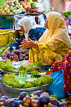 Women selling fruit and vegetables in the town market, Kota Bharu, Kelantan State, Malaysia 2008