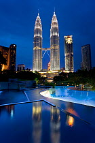Petronas Towers at night - 88 storey steel clad twin towers with a height of 451.9 metres - the iconic symbol of KLCC (Kuala Lumpar City Centre) urban development complex, Selangor, Malaysia 2008