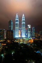 Petronas Towers at night - 88 storey steel clad twin towers with a height of 451.9 metres - the iconic symbol of KLCC (Kuala Lumpar City Centre) urban development complex, Selangor, Malaysia 2008