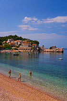 People on beach along the Adriatic Sea, Przno, Budva Riviera, Montenegro, Balkans 2007
