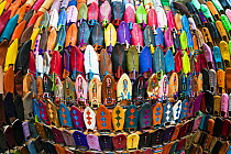 Wide angle view of soft leather Moroccan slippers in the Souk, Medina, Marrakech, Morocco, 2011