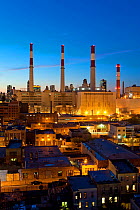 Queens Power Station above Manhanttan houses at dusk, New York, USA 2009