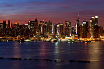 Midtown Manhattan skyline at night across Hudson River, New York, USA 2009
