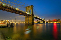 The Brooklyn and Manhattan Bridges spanning the East river at dusk, Manhattan, New York City, USA 2009
