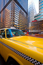 Yellow NYC Checker Taxi in the downtown Financial District of Manhattan, New York City, USA 2009