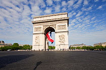 French flag under Arc de Triomphe built by Napoleon, Etoile, Paris, France 2011