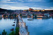 Looking down on St. Vitus Cathedral, Charles Bridge, UNESCO World Heritage Site, and the Castle District illuminated at night, Prague, Czech Republic 2011. No release available.