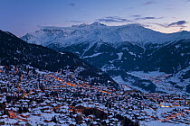 Resort of Four Valleys region and mountains at dusk, Valais, Verbier, Bernese Alps, Switzerland January 2009