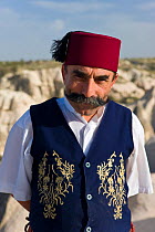 Turkish waiter outside a restaurant in Goreme, Cappadocia, Anatolia, Turkey, 2008