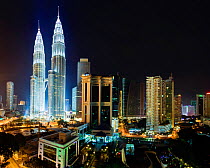 Elevated night view of the Petronas Twin Towers, illuminated at night, Kuala Lumpur, Malaysia, 2012. No release available.