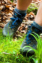 Hiking boots on the move. Scotland. Model released