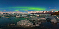 Aurora borealis over Jokulsarlon glacier lagoon. Southern Iceland, Europe, November 2012.