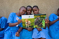Students reading Ranger Rick, a children's nature magazine. Kasiisi School funded by the Kasiisi School Project, just outside of Kibale National Park, Uganda, August 2011