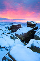 Sunrise over White Tor on Derwent Edge, looking on towards the Wheel Stones. Peak District National Park, January.