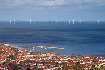 Offshore windfarm, and coastal town. Colwyn Bay, Wales.