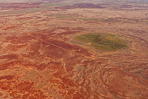 Aerial of Sturt Stoney Desert with gibber rocks. Gibber rocks are millions of years wind and water weathered chalcedonised sandstone with a hardened crust of soil cemented silica, iron and manganese,...