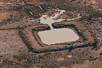 Aerial of Dam in the outback serving as watering holes for cattle. Dam water comes from bore water from the Great Artesian Basin, South Australia, Australia, June 2011